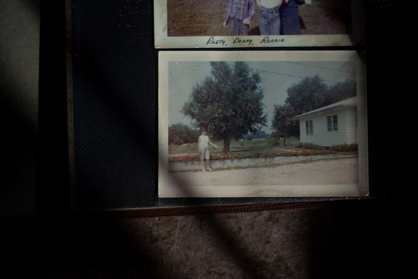 Wilma Reed stands near her flowers outside her home